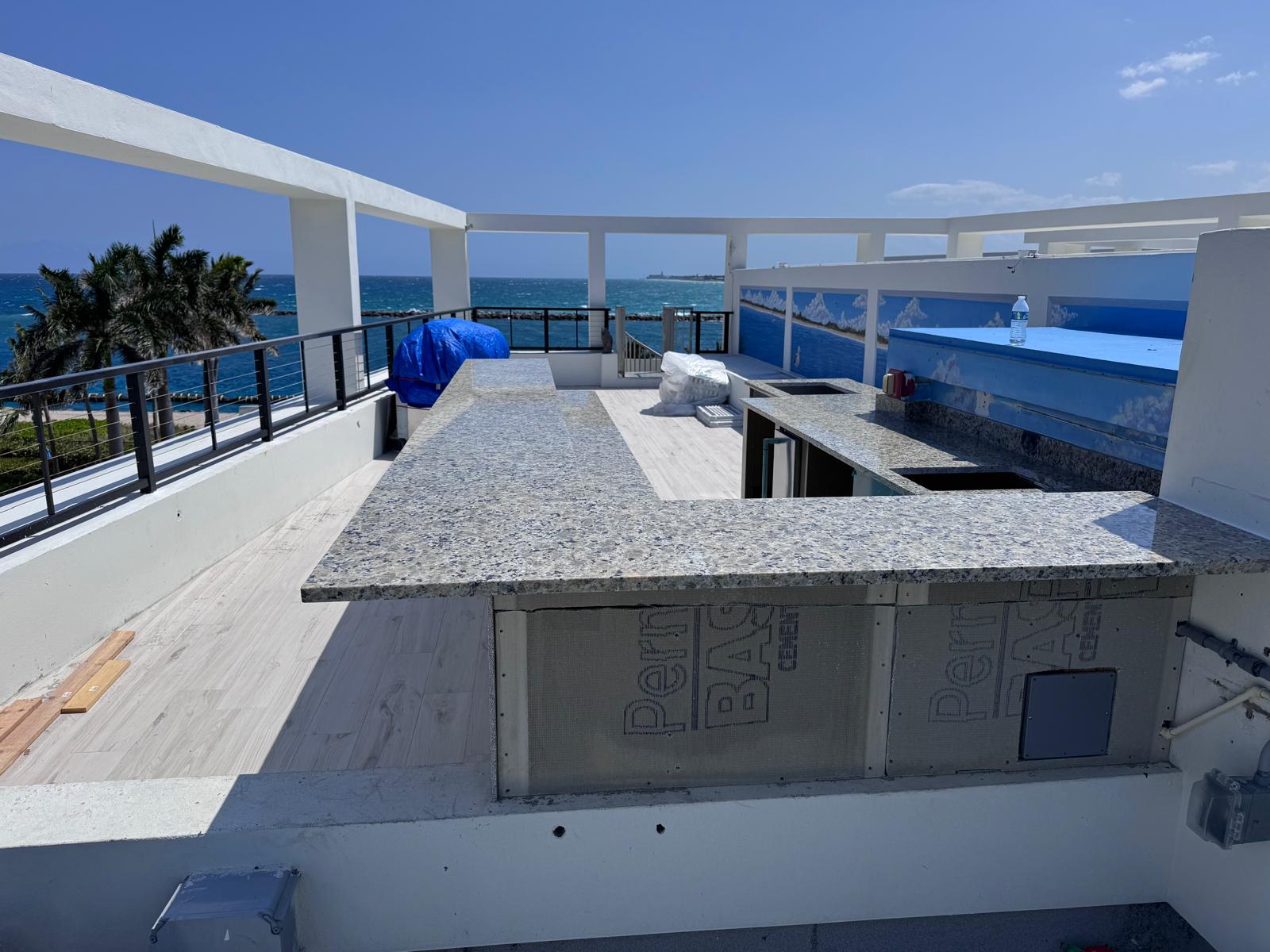 Rooftop granite bar with an ocean view