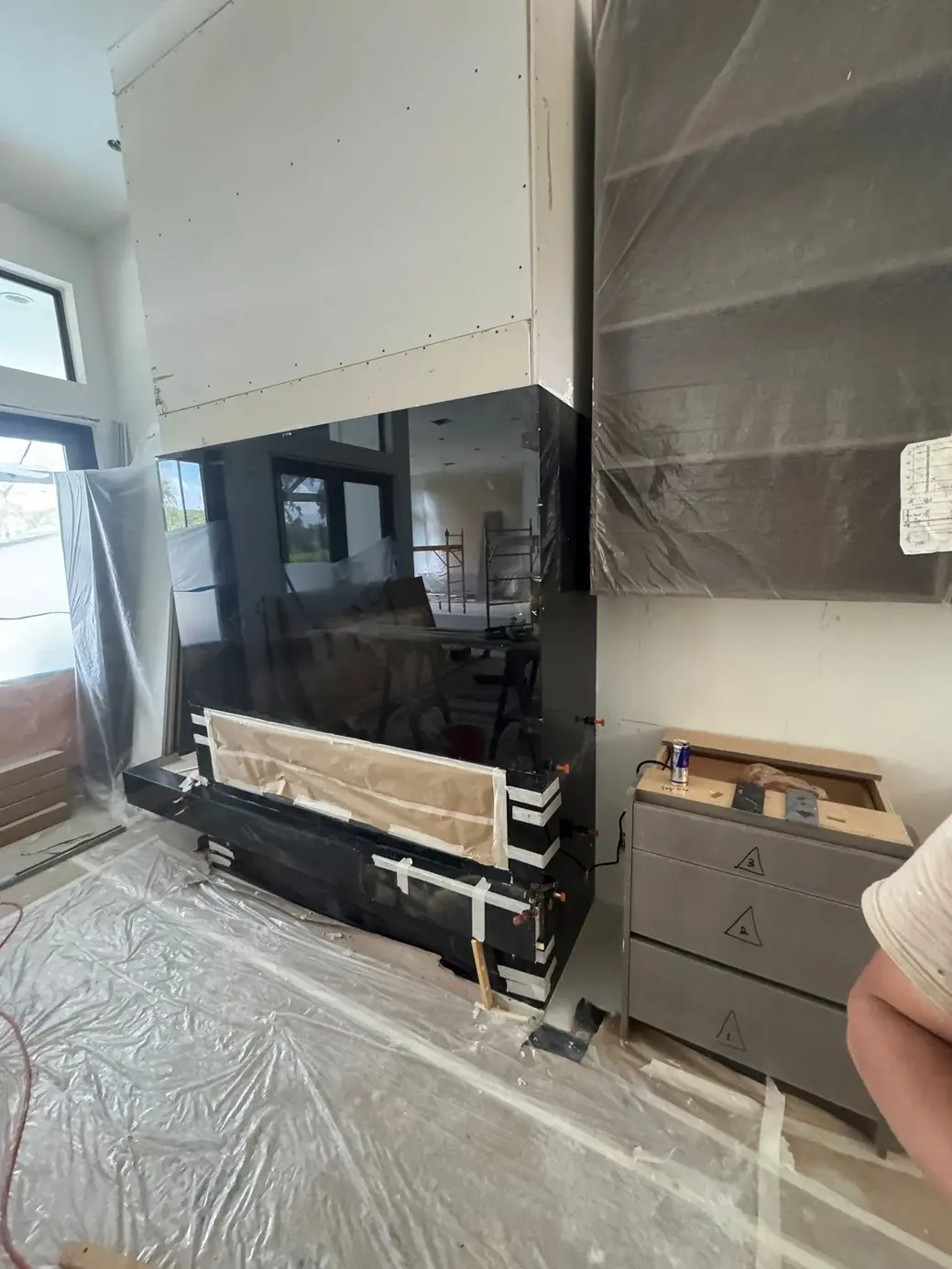 Black granite fireplace surround installation