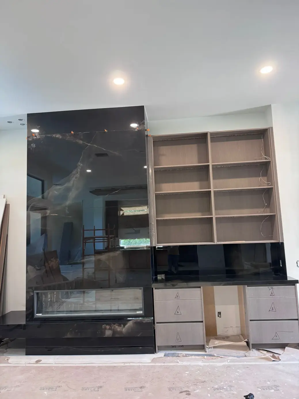 Black marble fireplace wall unit in Lake Worth
